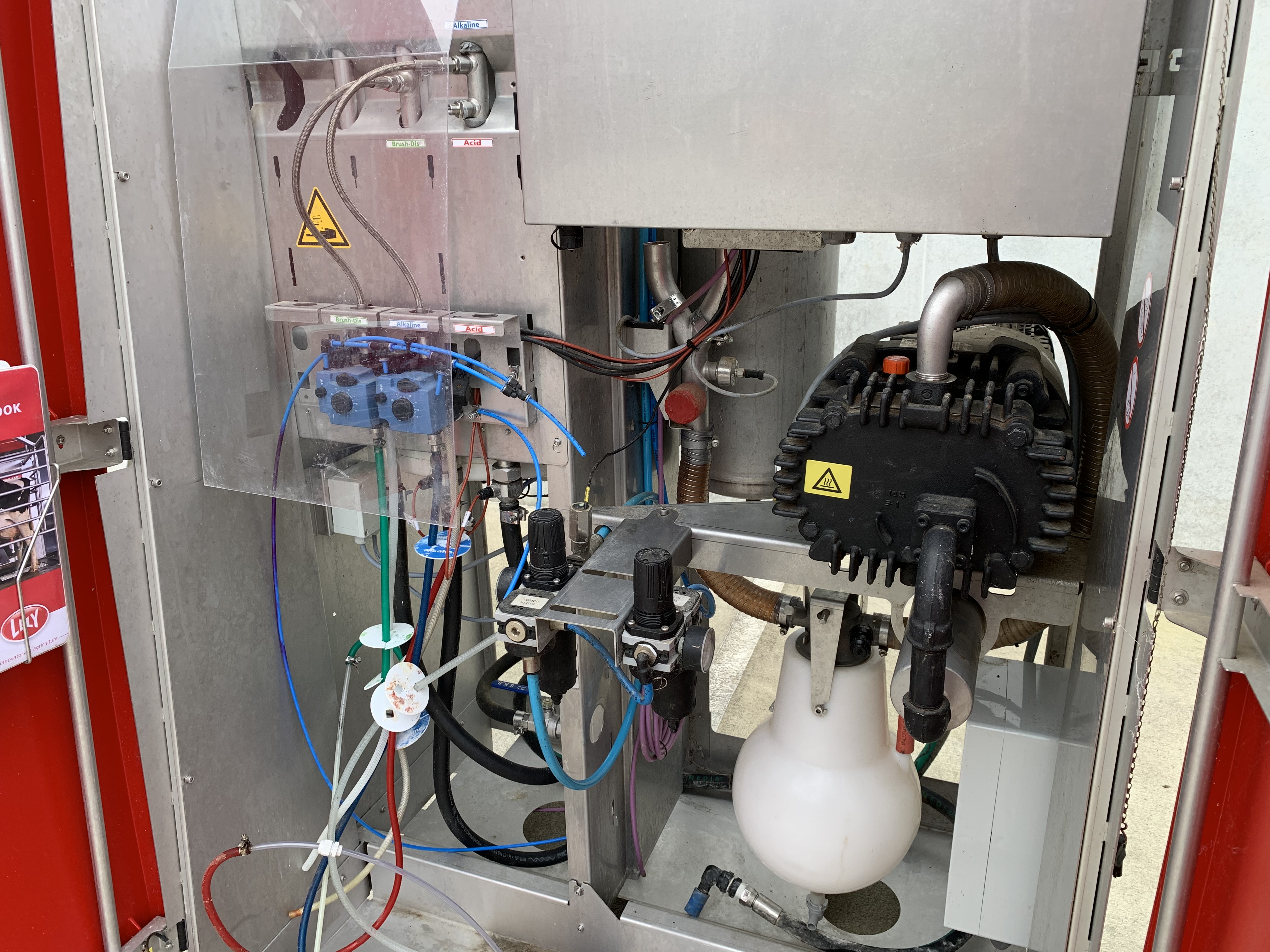 (Inside Central Unit) Showing CIP chemicals and vacuum pump